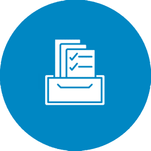 The hand of a person holding a scanner and pointing it at the barcode on the end of an archive box on a shelf